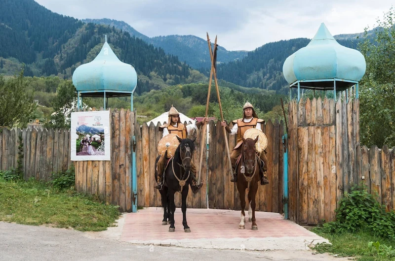 two-riders-in-front-of-the-entrance-of-the-kazakh-ethnographical-village-hwj8nn1-1749093468.webp