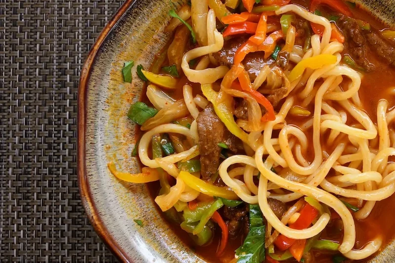 lagman-meat-mainly-lamb-beef-vegetables-pulled-long-noodles-include-bulgarian-peppers-eggplants-radish-potatoes-onions-258418038-1-1749269296.webp